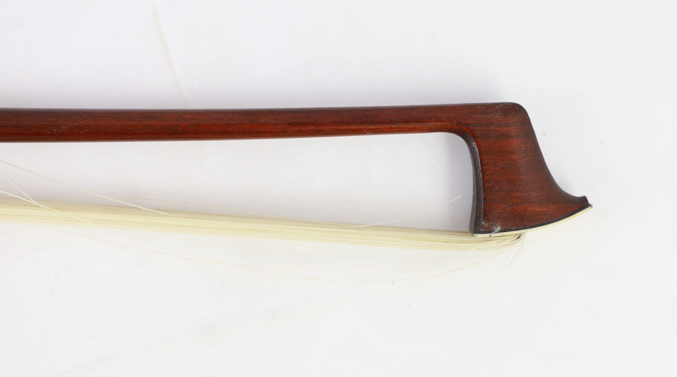 A silver mounted violin bow, stamped DODD, another stamped TOURTE and another bow